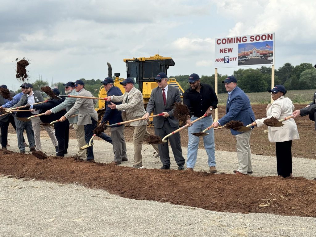 Officials with the City of Huntsville and Food City shovel dirt at the Food City groundbreaking in North Huntsville.