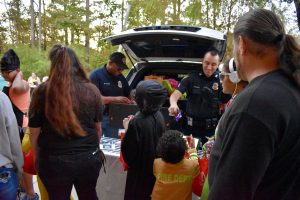 police officers handing out treats to children