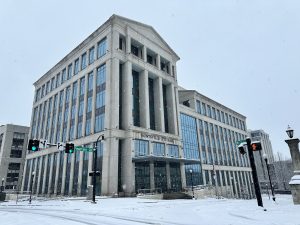 tall building with glass windows in the snow